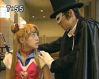 Sailormoon stares in awe at the mulleted Tuxedo Kamen.